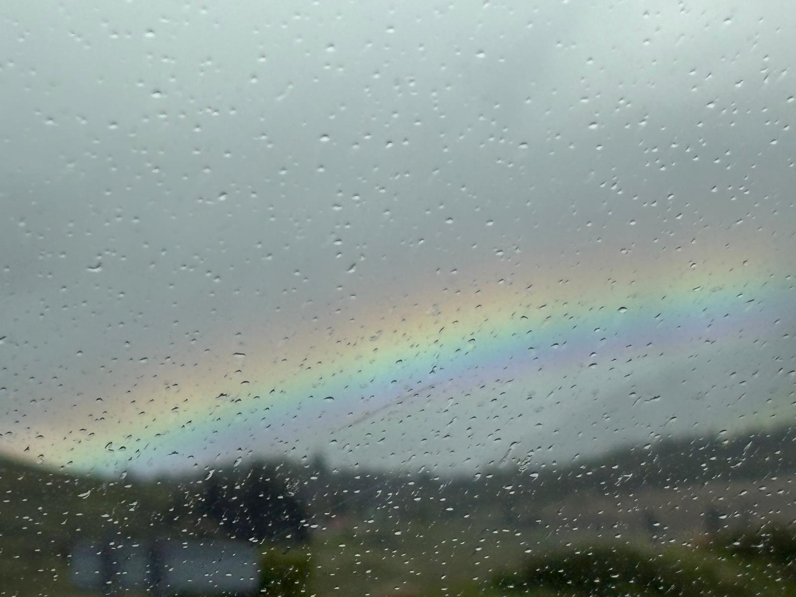 Rainbow out of a rainy window