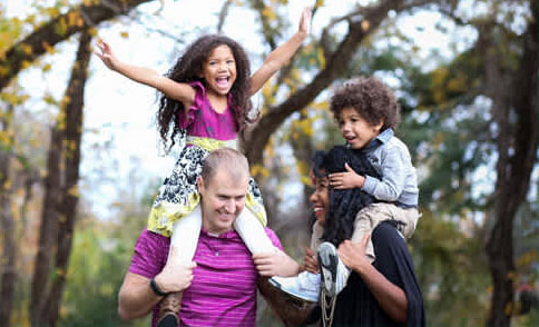 Parents with children on their shoulders